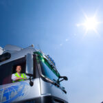 a-mid-shot-with-a-truck-driver-looking-outside-thr-2025-10-15-04-49-57-utc