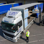 a-top-angle-shot-of-a-loading-dock-with-a-worker-s-2025-10-15-04-17-59-utc